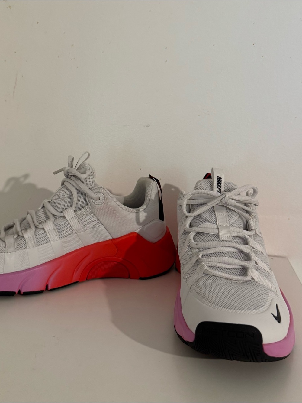 Nike Women’s White Sneakers with Pink-to-Red Gradient Sole